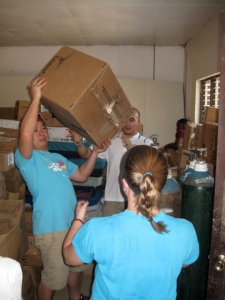 WSF Volunteers unload donated supplies from storage to the hospital